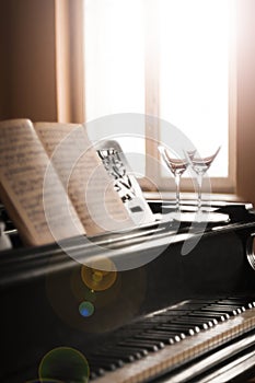 Glasses of wine and piano music