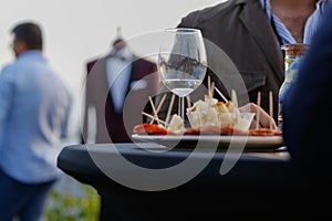 Glasses with wine and plate with food