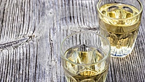 Glasses with wine on wooden table