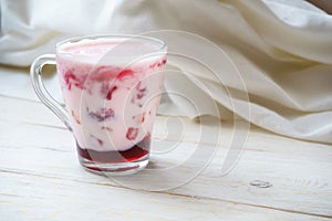 Glassful smoothie with yogurt and jam