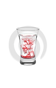 Glassfull of water with red stains