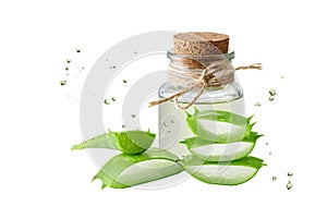 Glasss bottle with gel or juice of medicinal pure aloe vera leaf and slices stack isolated on white background with drops