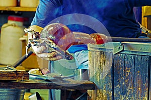 Glassworker in action in the Murano glassfactory 4