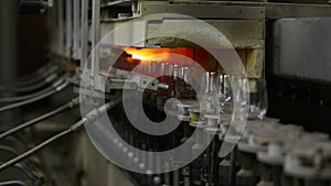 Glassworks factory with flames applied onto wineglasses