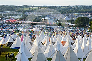 Glastonbury Festival, UK. 06/27/2015. Looking across Glastonbury Festival on a sunny day. With the teepee field in the foreground