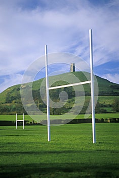 Glastonbury Tor, A sacred site along the English countryside in Glastonbury, England and goal posts in green field