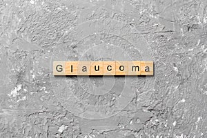 GLAUCOMA word written on wood block. GLAUCOMA text on cement table for your desing, concept