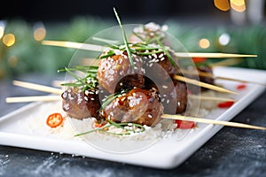 glazed beef teriyaki meatballs stacked on a platter
