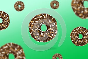 Glazed brown sweet sugar chocolate doughnut donut dessert on gradient green pastel background. Creative minimal blurred selective