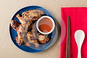 Glazed chicken wings with spice chillies sauce