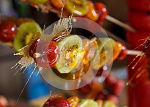 Glazed fruit on a stick