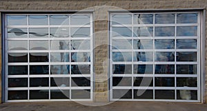 Glazed garage doors to accommodate automobiles