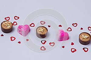 Glazed Luxury Candies for Special Event Sweet Confections with Confettin in Shape of Hearts on Blue Background Horizontal