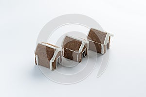 Glazed painted gingerbread houses on white background. Winter Holiday pattern. Copy space