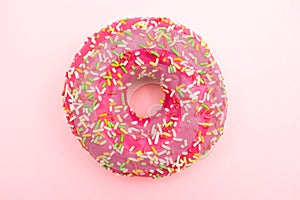 Glazed Pink donut on pink background.