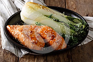 Glazed salmon fillet with sesame seeds and roasted cabbage bok c