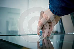 The glazier cuts the glass, hand holding a special cutting tool