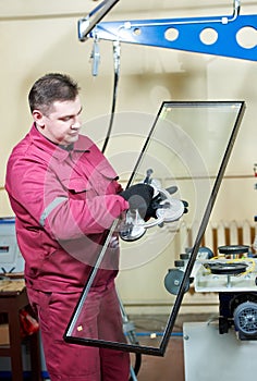 Glazier worker with glass