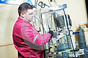 Glazier worker with glass