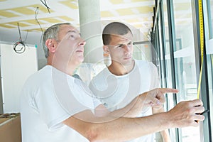 Glaziers inspecting the window