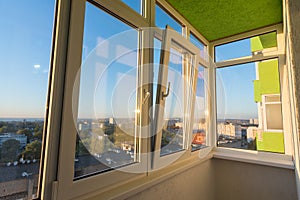 Glazing of a balcony in an apartment of a multi-storey residential building