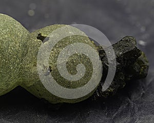 Gleaming prehnite formations take center stage in this piece, photo