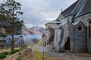 Glenfinnan Church with Loch Shiel Lake view and snowy Highlands