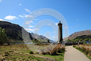 The Glenfinnan Monument is located in the Scottish Highlands on the shores of Loch Shiel.