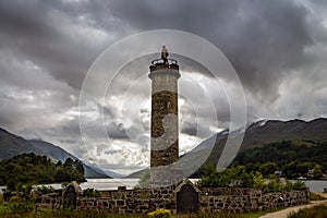 Glenfinnan Monument and Loch Shiel lake. Highlands Scotland Uk