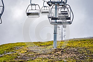 Glenshee Mountain Ski Centre and Snowsports School with empty chairlift seats