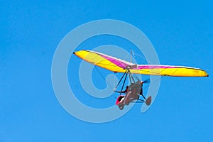Glider high in the sky. Glider on a blue sky background.