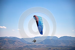 glider paragliding g against blue sky flying  adrenaline and freedom concept