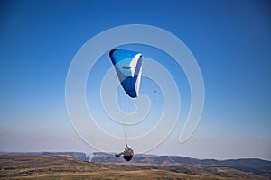 glider paragliding g against blue sky flying  adrenaline and freedom concept