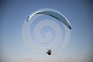 glider paragliding g against blue sky flying  adrenaline and freedom concept