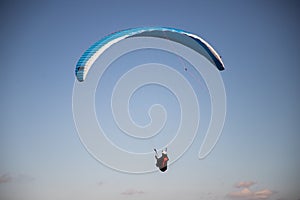 glider paragliding g against blue sky flying  adrenaline and freedom concept