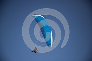 glider paragliding g against blue sky flying  adrenaline and freedom concept