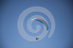 glider paragliding g against blue sky flying  adrenaline and freedom concept