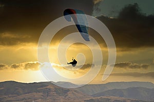 glider paragliding at sunset flying  adrenaline and freedom concept