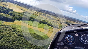 Glider plane cockpit view while approaching runway