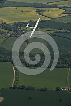 Glider, sailplane flying over countryside. photo