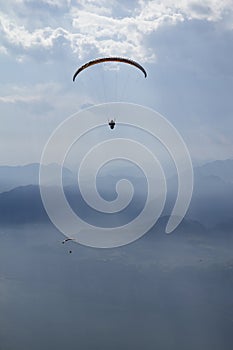 Gliders flying over the lake and the mountains