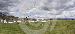 Gliders in line on runway at glider airfield, Omarama, New Zealand