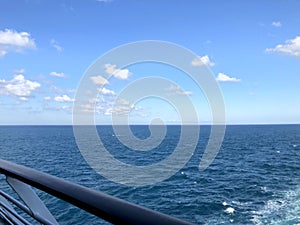 A glimpse of the blue sea from the deck of a cruise ship.