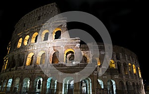 Glimpse of the Colosseum at night, in Rome