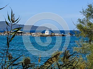 A glimpse of  the Marine Down Galata chapel on a peninsula near Chania, Crete on a bright sunny day