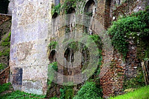 A glimpse of old brick Roman walls and vegetation