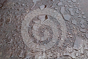 A Glimpse of Perfection: The Beauty of Water Drops on Metal