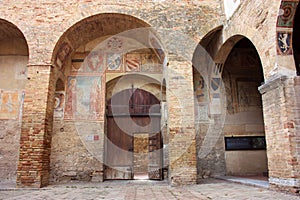 Glimpses of the romantic Tuscan town of San Gimignano in stones on the ancient hill