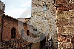 Glimpses of the romantic Tuscan town of San Gimignano in stones on the ancient hill