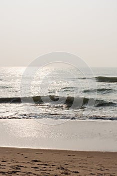 Glistening waves on beach